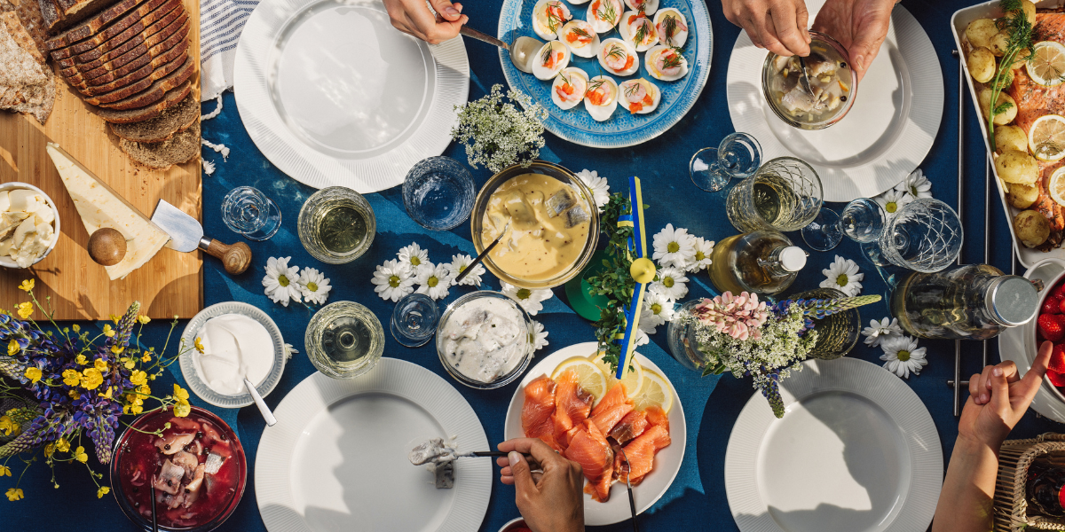 stock image of the top view of a summer table laid with various foods and flowers
