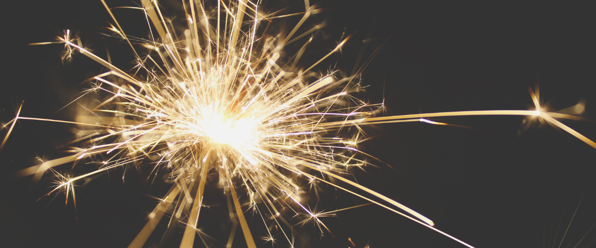 a sparkler on a black background