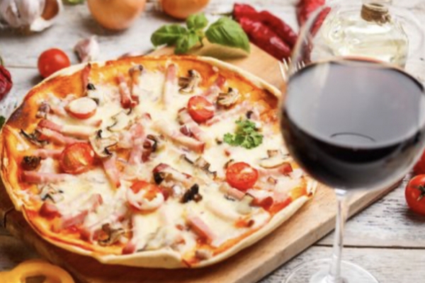 Glass of red wine and pizza