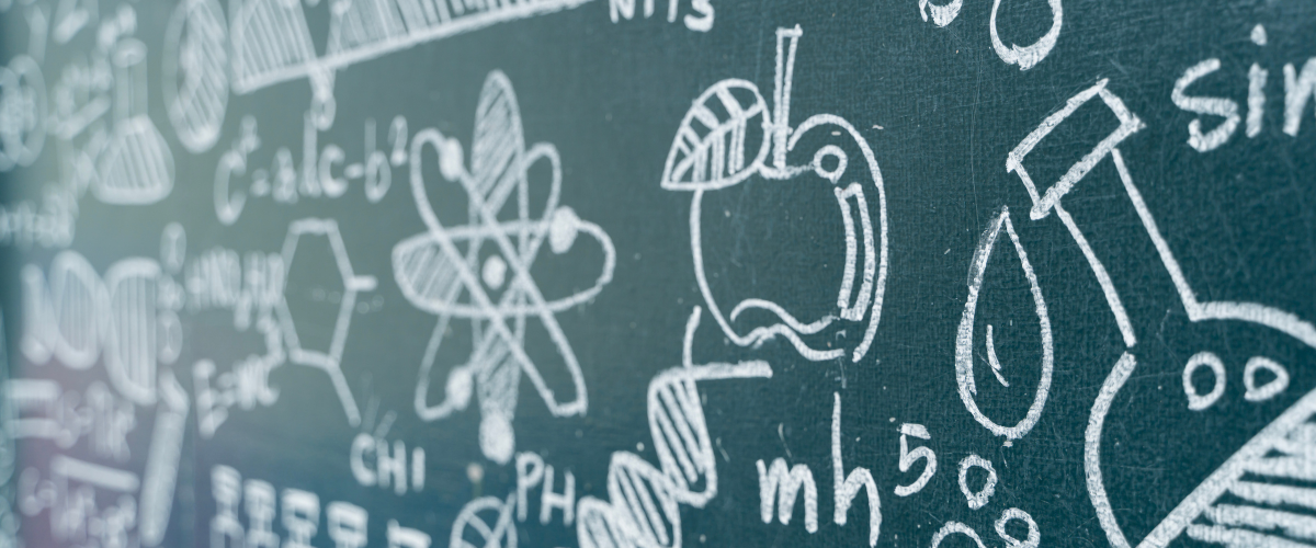 Science chalkboard with hand-drawn chemistry formulas