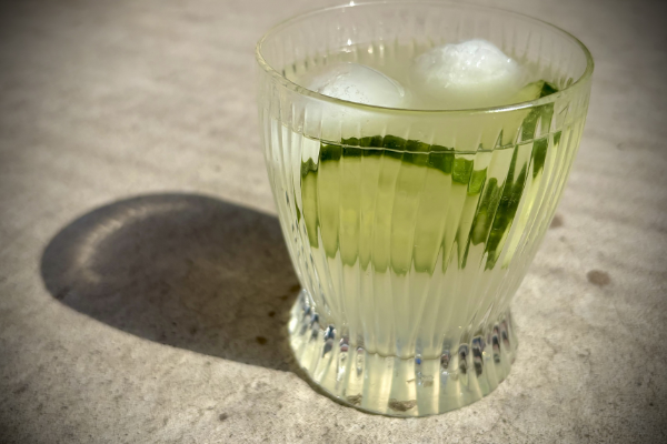 a white linen cocktail with a long shadow