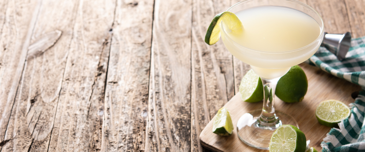 classic daiquiri in a coup one a wood plank