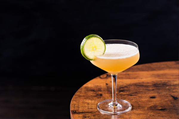 classic rum daiquiri in a coup on a wooden table