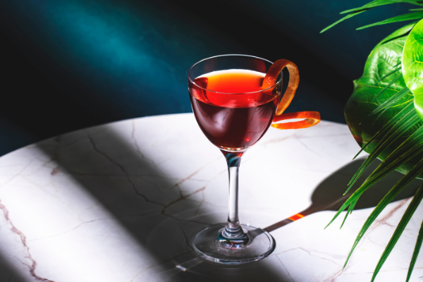 red bijou cocktail in the sun