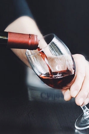 red wine being poured into glass