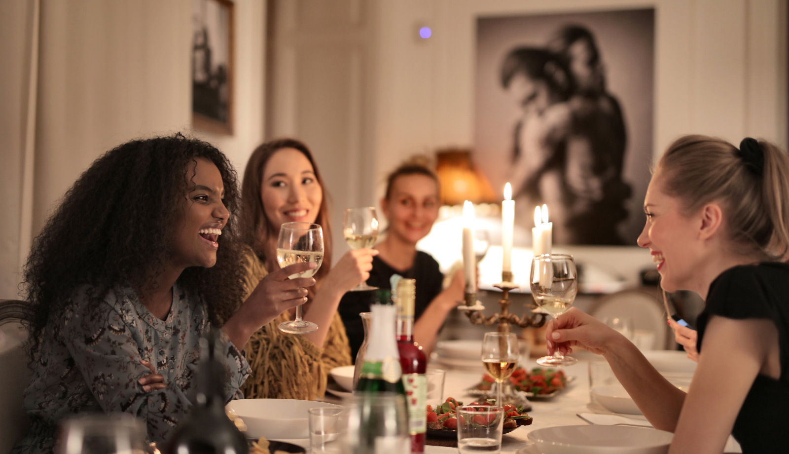 women at a restaurant table with wine