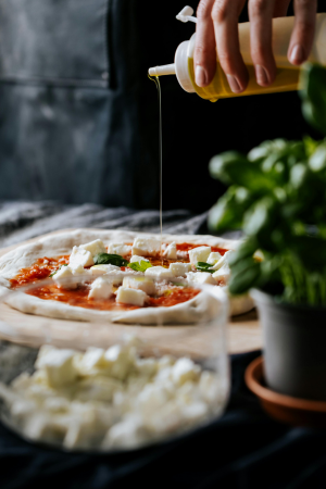 Artisan Pizza Making with Olive Oil Drizzle