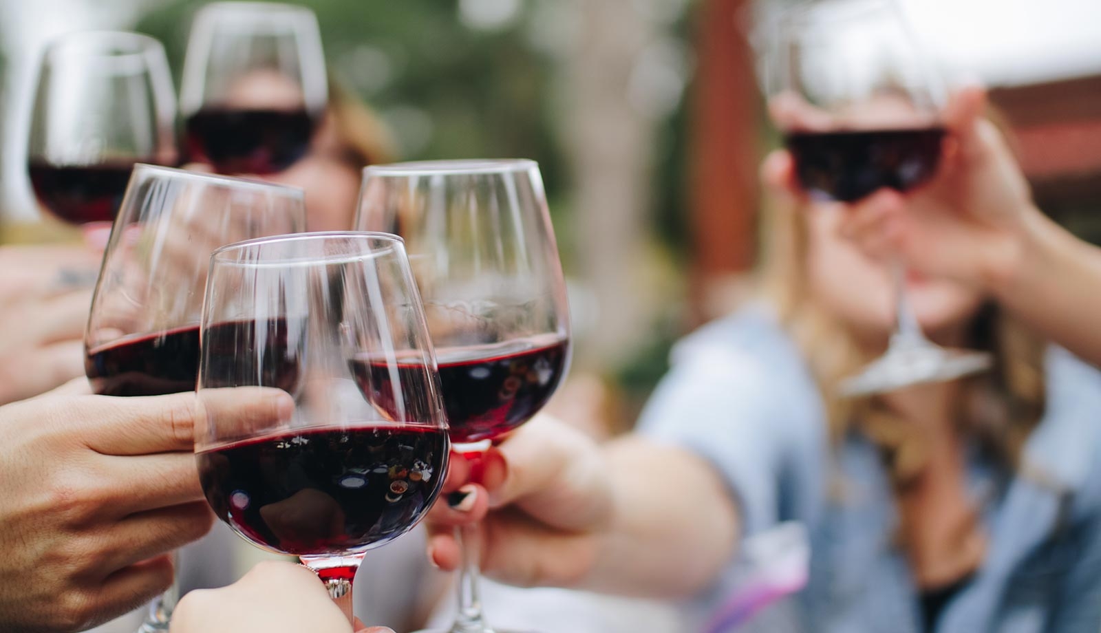 Red wine glasses clinking